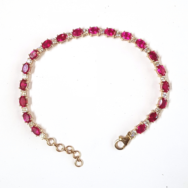 Created Oval Rubies and Round Moissanite Diamond Tennis Bracelet